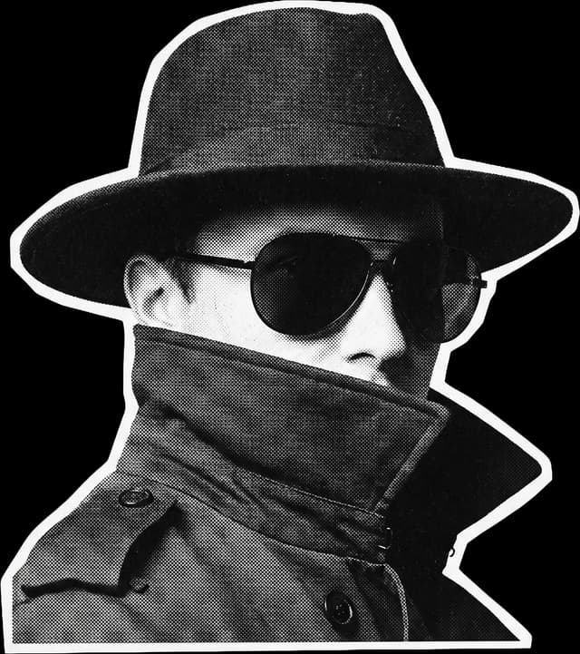 Anonymous figure in a hat and sunglasses representing a fake or dead lead